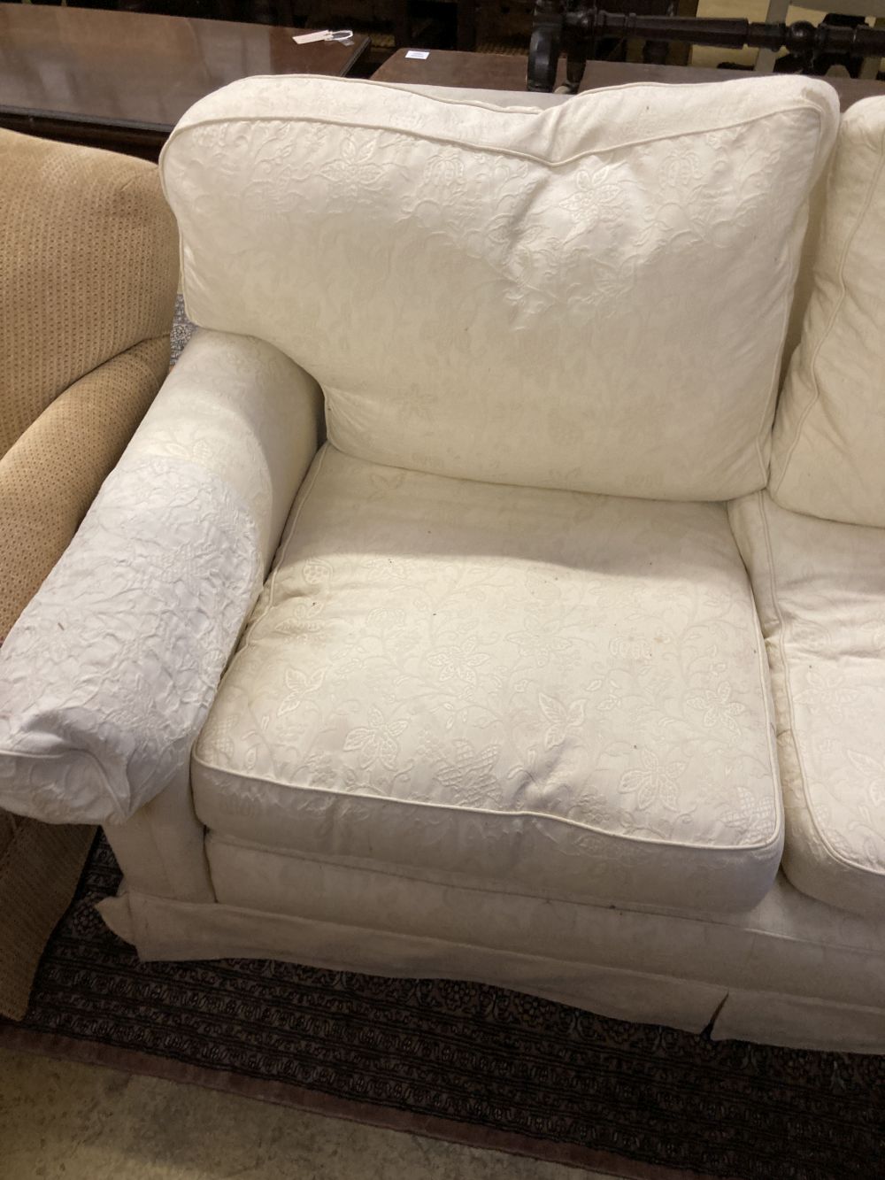 A contemporary cream brocade upholstered two seater settee, width 170cm depth 92cm height 86cm